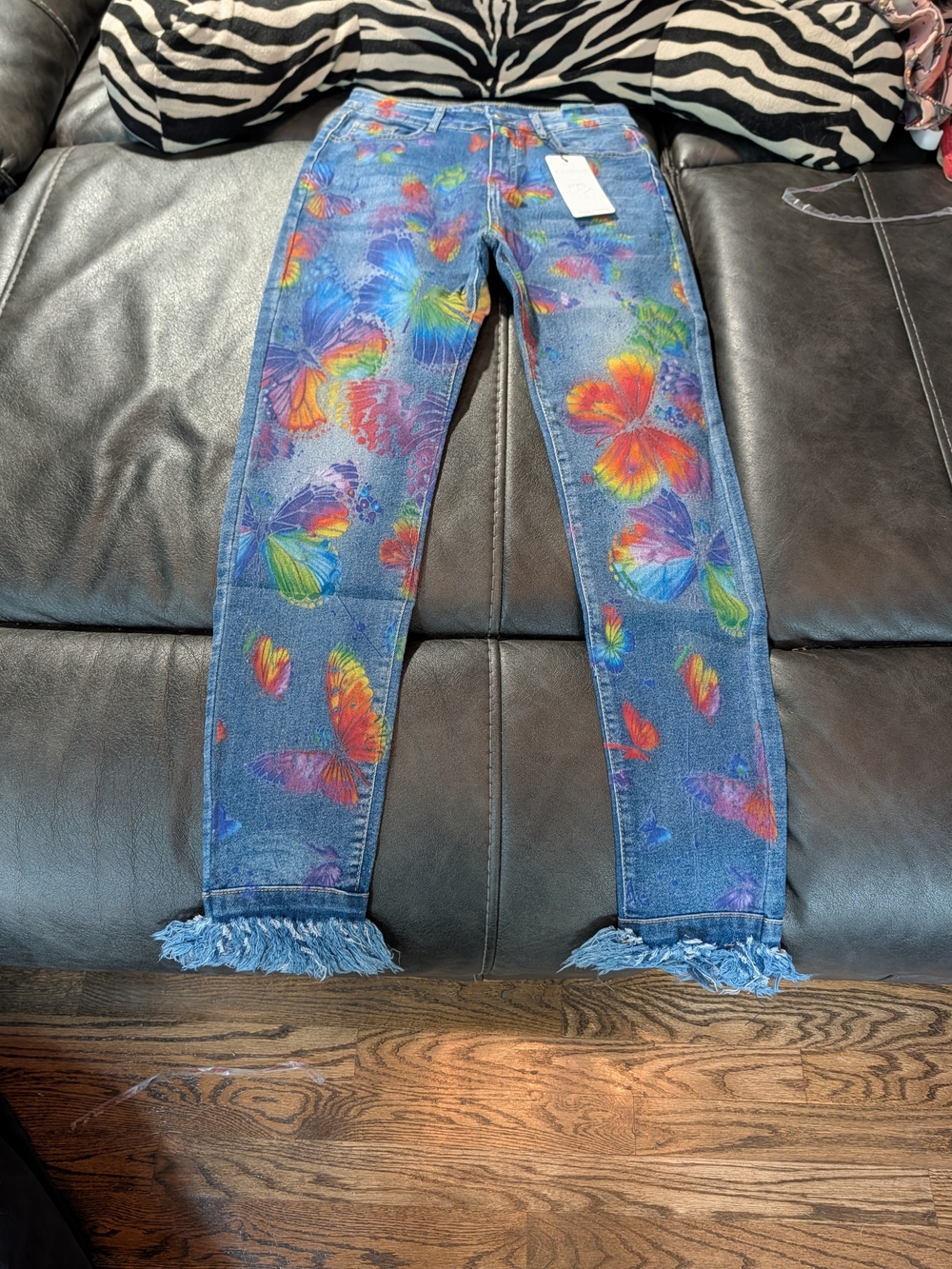 NWT Women’s Blue Denim Jeans with Multicolor Butterfly Print And Fringed Hem